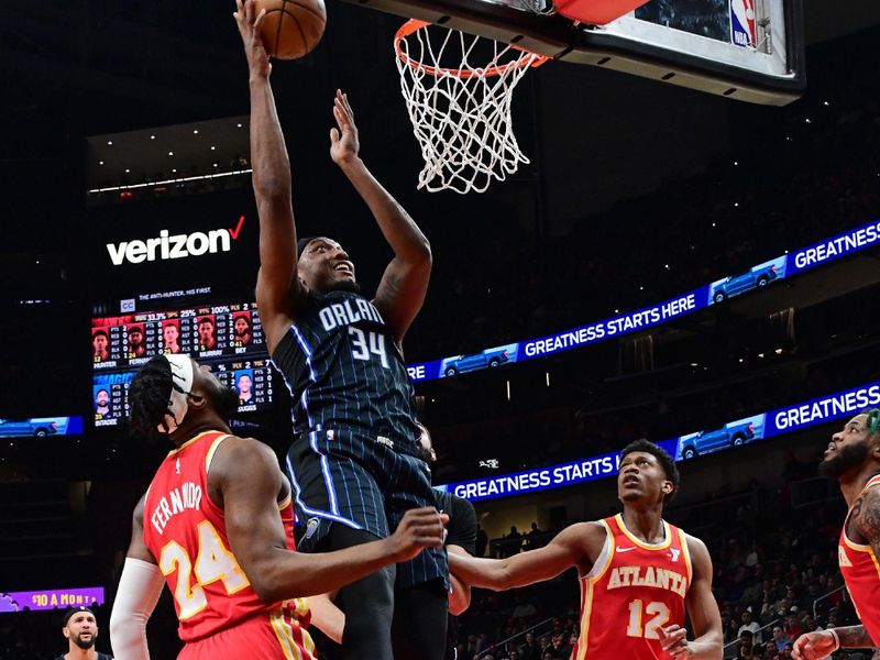 ATLANTA, GA - FEBRUARY 25: Wendell Carter Jr. #34 of the Orlando Magic shoots the ball during the game against the Atlanta Hawks on February 25, 2024 at State Farm Arena in Atlanta, Georgia.  NOTE TO USER: User expressly acknowledges and agrees that, by downloading and/or using this Photograph, user is consenting to the terms and conditions of the Getty Images License Agreement. Mandatory Copyright Notice: Copyright 2024 NBAE (Photo by Scott Cunningham/NBAE via Getty Images)