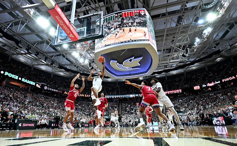 Jan 13, 2026; East Lansing, Michigan, USA;  Michigan State Spartans guard Jeremy Fears Jr. (1) takes a steal to the basket past the Indiana Hoosiers defense during the second half at Jack Breslin Student Events Center. Mandatory Credit: Dale Young-Imagn Images