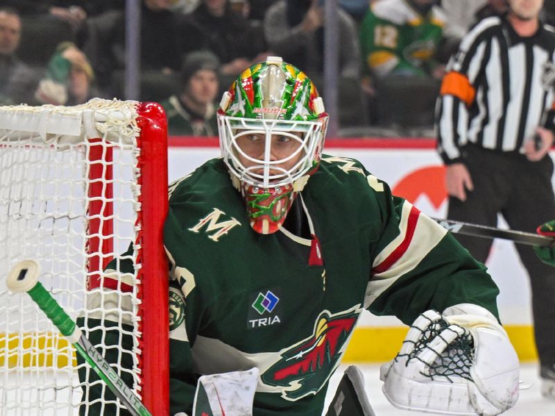 Dec 13, 2025; Saint Paul, Minnesota, USA;  Minnesota Wild goalie Jesper Wallstedt (30) tracks the puck against the Ottawa Senators during the first period at Grand Casino Arena. Mandatory Credit: Nick Wosika-Imagn Images
