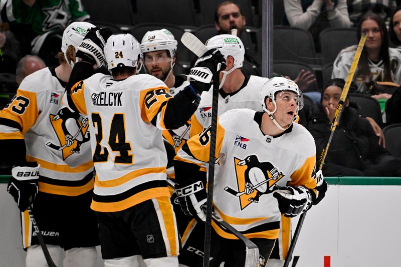 Apr 5, 2025; Dallas, Texas, USA; Pittsburgh Penguins center Blake Lizotte (46) and defenseman Matt Grzelcyk (24) and defenseman Kris Letang (58) celebrates with his Lizotte after he scores game winning goal against the Dallas Stars during the third period at the American Airlines Center. Mandatory Credit: Jerome Miron-Imagn Images