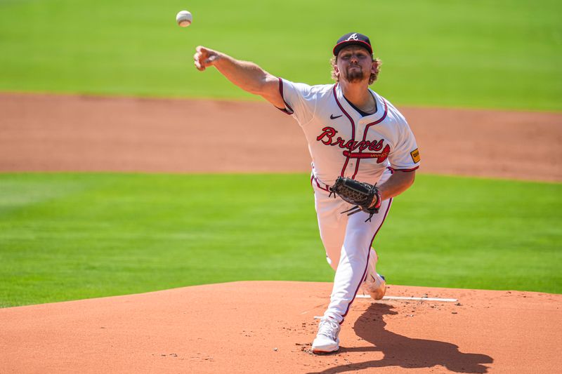 Jun 30, 2024; Cumberland, Georgia, USA; Atlanta Braves starting pitcher Spencer Schwellenbach (56) pitches against the Pittsburgh Pirates during the first inning at Truist Park. Mandatory Credit: Dale Zanine-USA TODAY Sports