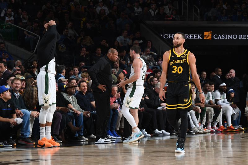 SAN FRANCISCO, CA - MARCH 6:  Stephen Curry #30 of the Golden State Warriors smiles during the game against the Milwaukee Bucks on MARCH 6, 2024 at Chase Center in San Francisco, California. NOTE TO USER: User expressly acknowledges and agrees that, by downloading and or using this photograph, user is consenting to the terms and conditions of Getty Images License Agreement. Mandatory Copyright Notice: Copyright 2024 NBAE (Photo by Noah Graham/NBAE via Getty Images)