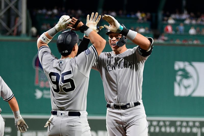 Sep 14, 2023; Boston, Massachusetts, USA; New York Yankees designated hitter Aaron Judge (99) celebrates a three run home run against the Boston Red Sox with right fielder Oswaldo Cabrera (95) during the second inning at Fenway Park. Mandatory Credit: Eric Canha-USA TODAY Sports