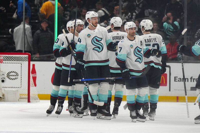 Dec 20, 2023; Los Angeles, California, USA; Seattle Kraken defenseman Jamie Oleksiak (24) and right wing Jordan Eberle (7) celebrate at the end of the game against the LA Kings at Crypto.com Arena. Mandatory Credit: Kirby Lee-USA TODAY Sports