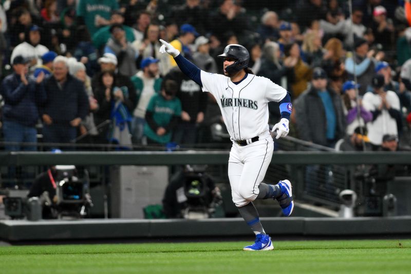 Apr 15, 2023; Seattle, Washington, USA; Seattle Mariners third baseman Eugenio Suarez (28) celebrates after hitting a home run against the Colorado Rockies during the fourth inning at T-Mobile Park. Mandatory Credit: Steven Bisig-USA TODAY Sports