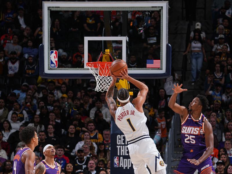 DENVER, CO - OCTOBER 13: Michael Porter Jr. #1 of the Denver Nuggets drives to the basket during the game against the Phoenix Suns on October 13, 2024 at Ball Arena in Denver, Colorado. NOTE TO USER: User expressly acknowledges and agrees that, by downloading and/or using this Photograph, user is consenting to the terms and conditions of the Getty Images License Agreement. Mandatory Copyright Notice: Copyright 2024 NBAE (Photo by Garrett Ellwood/NBAE via Getty Images)