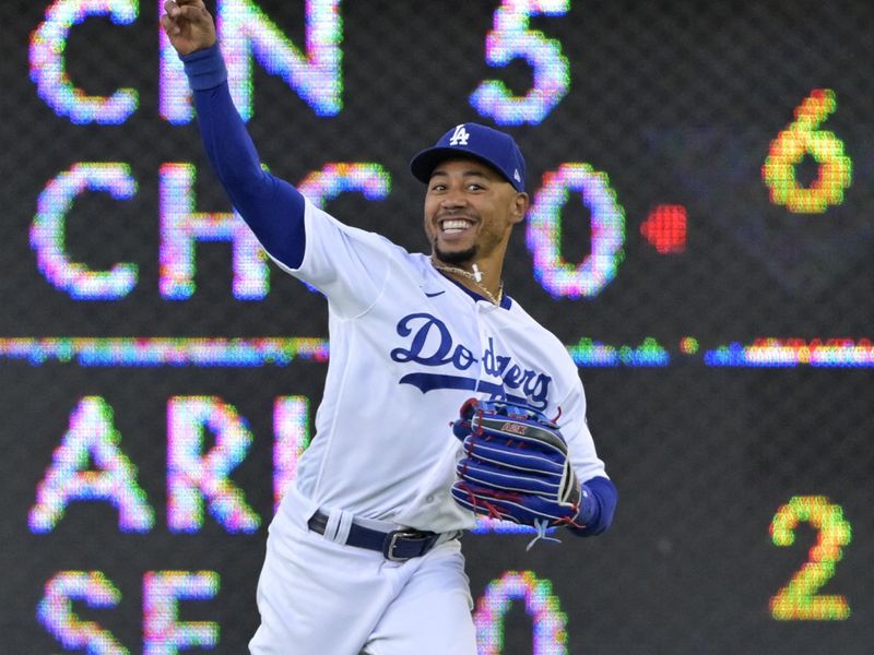 Aug 2, 2023; Los Angeles, California, USA;  Los Angeles Dodgers right fielder Mookie Betts (50) throws the ball in to hold Oakland Athletics second baseman Tony Kemp (5) at second base in the first inning at Dodger Stadium. Mandatory Credit: Jayne Kamin-Oncea-USA TODAY Sports