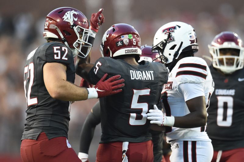 Sep 7, 2024; Pullman, Washington, USA; Washington State Cougars linebacker Kyle Thornton (52) and defensive back Tyson Durant (5) celebrate after a play against the Texas Tech Red Raiders in the first half at Gesa Field at Martin Stadium. Mandatory Credit: James Snook-Imagn Images