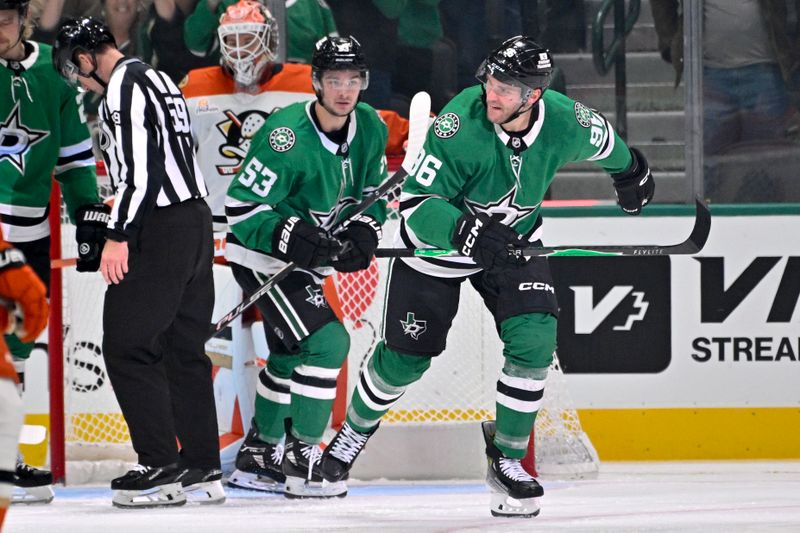 Nov 6, 2025; Dallas, Texas, USA; Dallas Stars center Wyatt Johnston (53) and right wing Mikko Rantanen (96) celebrates a power play goal scored by Rantanen against the Anaheim Ducks during the third period at the American Airlines Center. Mandatory Credit: Jerome Miron-Imagn Images