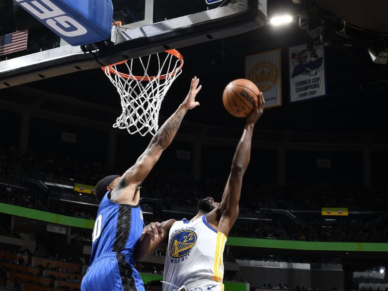 ORLANDO, FL - MARCH 27: Andrew Wiggins #22 of the Golden State Warriors drives to the basket during the game against the Orlando Magic on March 27, 2024 at Amway Center in Orlando, Florida. NOTE TO USER: User expressly acknowledges and agrees that, by downloading and or using this photograph, User is consenting to the terms and conditions of the Getty Images License Agreement. Mandatory Copyright Notice: Copyright 2024 NBAE (Photo by Fernando Medina/NBAE via Getty Images)