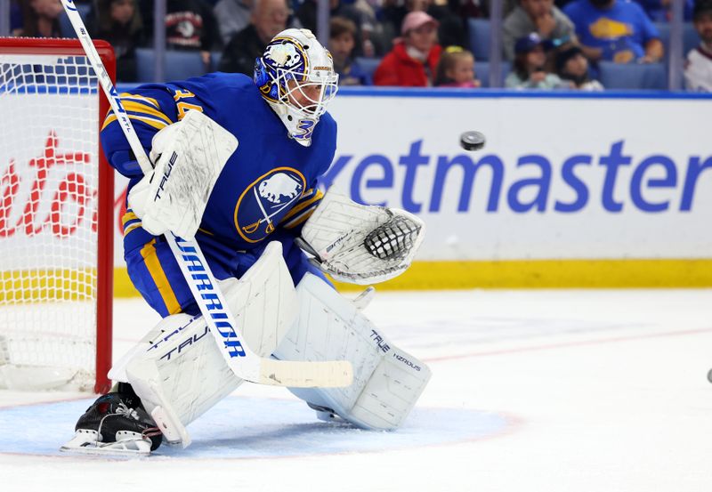 Oct 13, 2025; Buffalo, New York, USA;  Buffalo Sabres goaltender Alex Lyon (34) looks to make a save during the third period against the Colorado Avalanche at KeyBank Center. Mandatory Credit: Timothy T. Ludwig-Imagn Images