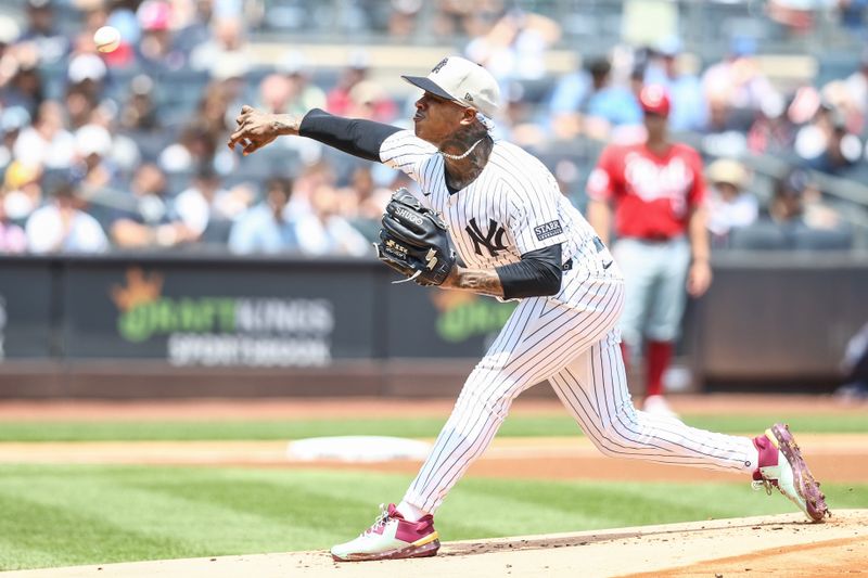 Jul 4, 2024; Bronx, New York, USA; New York Yankees starting pitcher Marcus Stroman (0) pitches in the first inning against the Cincinnati Reds at Yankee Stadium. Mandatory Credit: Wendell Cruz-USA TODAY Sports