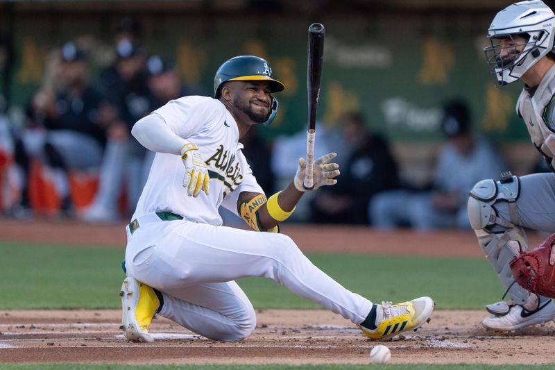 Aug 6, 2024; Oakland, California, USA;  Oakland Athletics outfielder Miguel Andujar (22) reacts after getting hit by a pitch during the first inning against the Chicago White Sox at Oakland-Alameda County Coliseum. Mandatory Credit: Stan Szeto-USA TODAY Sports