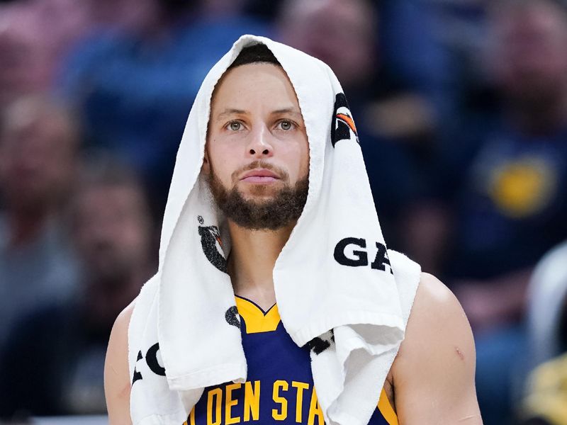 INDIANAPOLIS, INDIANA - FEBRUARY 08: Stephen Curry #30 of the Golden State Warriors looks on from the bench in the fourth quarter against the Indiana Pacers at Gainbridge Fieldhouse on February 08, 2024 in Indianapolis, Indiana. NOTE TO USER: User expressly acknowledges and agrees that, by downloading and or using this photograph, User is consenting to the terms and conditions of the Getty Images License Agreement. (Photo by Dylan Buell/Getty Images)