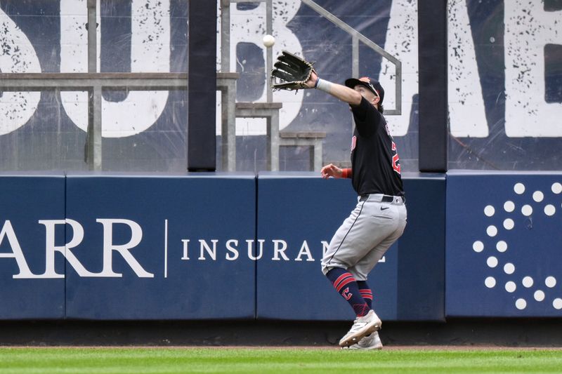 Aug 22, 2024; Bronx, New York, USA; Cleveland Guardians outfielder Tyler Freeman (2) catches a fly ball for an out against the New York Yankees during the seventh inning at Yankee Stadium. Mandatory Credit: John Jones-USA TODAY Sports