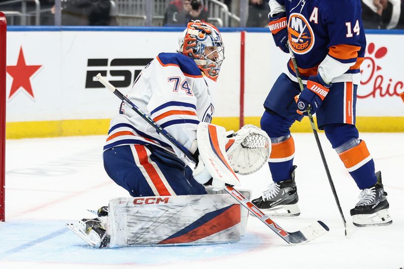 Oct 16, 2025; Elmont, New York, USA; Edmonton Oilers goaltender Stuart Skinner (74) defends the net in the second period against the New York Islanders at UBS Arena. Mandatory Credit: Wendell Cruz-Imagn Images