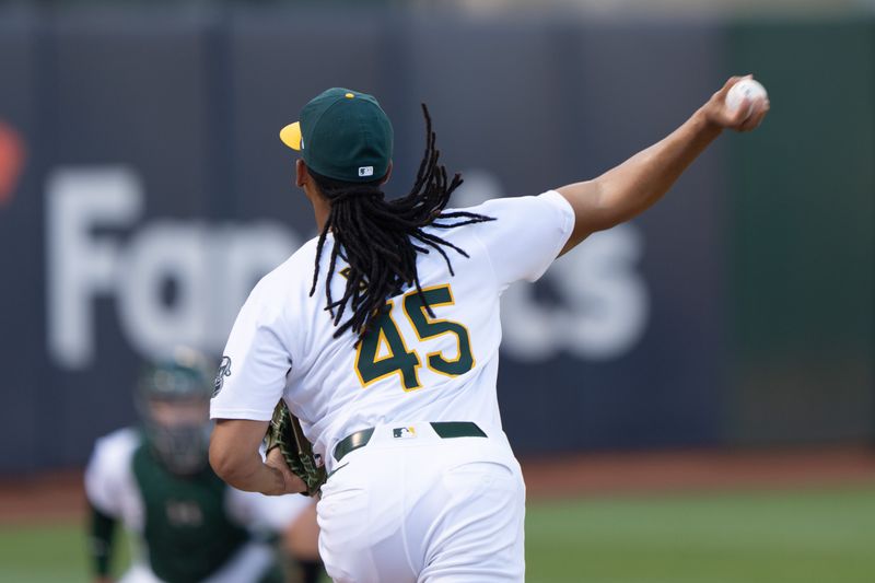 Jul 23, 2024; Oakland, California, USA;  Oakland Athletics pitcher Osvaldo Bido (45) warms up before the start of the first inning against the Houston Astros at Oakland-Alameda County Coliseum. Mandatory Credit: Stan Szeto-USA TODAY Sports