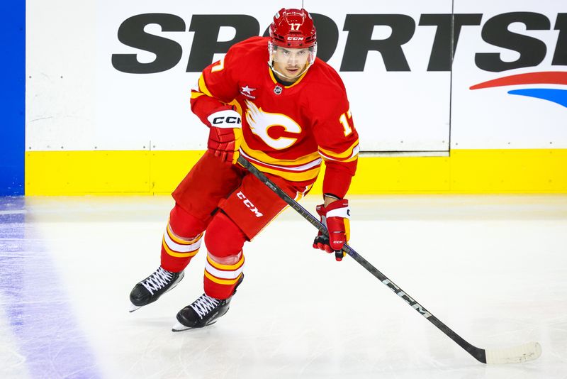 Sep 23, 2024; Calgary, Alberta, CAN; Calgary Flames center Yegor Sharangovich (17) skates during the warmup period against the Edmonton Oilers at Scotiabank Saddledome. Mandatory Credit: Sergei Belski-Imagn Images