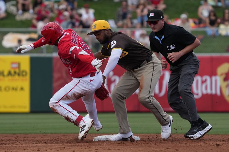 Mar 10, 2026; Tempe, Arizona, USA; Los Angeles Angels third baseman Nick Madrigal (2) is tagged out by San Diego Padres outfielder Pablo Reyes (26) in the second inning at Tempe Diablo Stadium. Mandatory Credit: Rick Scuteri-Imagn Images