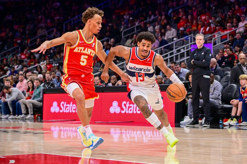 ATLANTA, GA - OCTOBER 28:  Jordan Poole #13 of the Washington Wizards drives to the basket during the game on October 28, 2024 at State Farm Arena in Atlanta, Georgia.  NOTE TO USER: User expressly acknowledges and agrees that, by downloading and/or using this Photograph, user is consenting to the terms and conditions of the Getty Images License Agreement. Mandatory Copyright Notice: Copyright 2024 NBAE (Photo by Adam Hagy/NBAE via Getty Images)