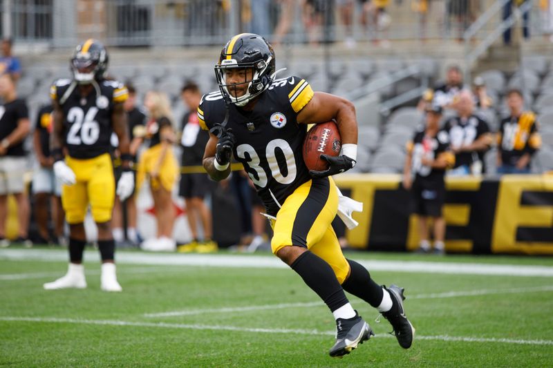 Pittsburgh Steelers running back Jaylen Warren (30) returns a kick during warmups of a preseason NFL football game, Saturday, Aug. 13, 2022, in Pittsburgh, PA. (AP Photo/Matt Durisko)