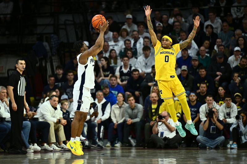 Jan 7, 2024; Philadelphia, Pennsylvania, USA; Penn State Nittany Lions guard Kanye Clary (0) shoots against Michigan Wolverines guard Dug McDaniel (0) in the second half at The Palestra. Mandatory Credit: Kyle Ross-USA TODAY Sports