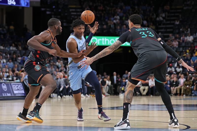 MEMPHIS, TENNESSEE - MARCH 12: GG Jackson #45 of the Memphis Grizzlies drives to the basket against Kyle Kuzma #33 of the Washington Wizards and Eugene Omoruyi #97 during the second half at FedExForum on March 12, 2024 in Memphis, Tennessee. NOTE TO USER: User expressly acknowledges and agrees that, by downloading and or using this photograph, User is consenting to the terms and conditions of the Getty Images License Agreement. (Photo by Justin Ford/Getty Images)