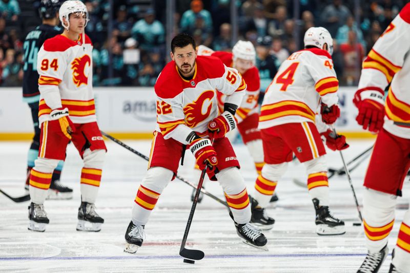 Oct 19, 2024; Seattle, Washington, USA; Calgary Flames defenseman MacKenzie Weegar (52) warms up before the game against the Seattle Kraken at Climate Pledge Arena. Mandatory Credit: Caean Couto-Imagn Images