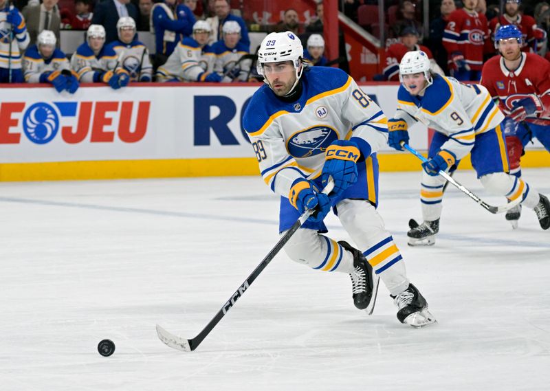 Feb 21, 2024; Montreal, Quebec, CAN; Buffalo Sabres forward Alex Tuch (89)  plays the puck during the second period of the game against the Montreal Canadiens at the Bell Centre. Mandatory Credit: Eric Bolte-USA TODAY Sports