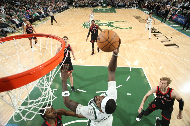 MILWAUKEE, WI - APRIL 5: Bobby Portis #9 of the Milwaukee Bucks drives to the basket during the game against the Toronto Raptors on April 5, 2024 at the Fiserv Forum Center in Milwaukee, Wisconsin. NOTE TO USER: User expressly acknowledges and agrees that, by downloading and or using this Photograph, user is consenting to the terms and conditions of the Getty Images License Agreement. Mandatory Copyright Notice: Copyright 2024 NBAE (Photo by Gary Dineen/NBAE via Getty Images).