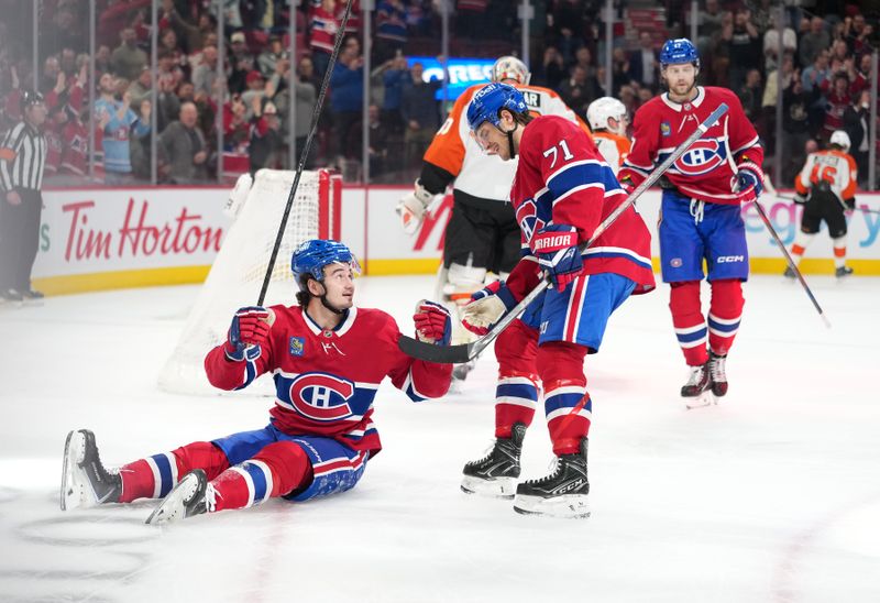 Dec 16, 2025; Montreal, Quebec, CAN; Montreal Canadians forward Alexandre Texier (85) celebrates with teammates including forward Jake Evans (71) and forward Josh Anderson (17) after scoring a goal against the Philadelphia Flyers during the first period at the Bell Centre. Mandatory Credit: Eric Bolte-Imagn Images