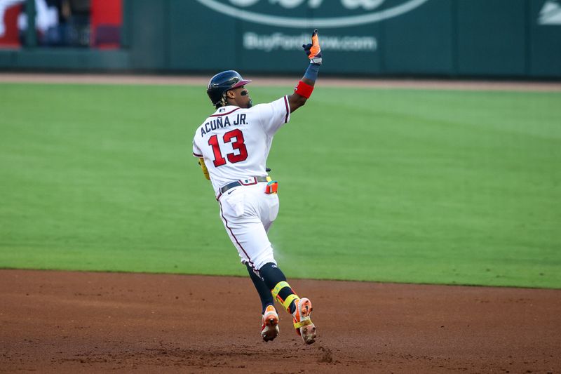 Jun 27, 2023; Atlanta, Georgia, USA; Atlanta Braves right fielder Ronald Acuna Jr. (13) reacts after a home run against the Minnesota Twins in the first inning at Truist Park. Mandatory Credit: Brett Davis-USA TODAY Sports
