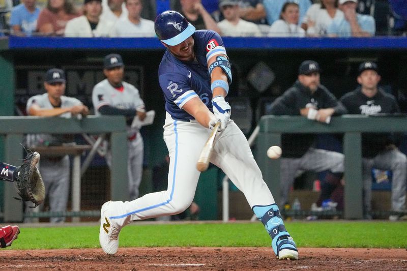 Sep 6, 2024; Kansas City, Missouri, USA; Kansas City Royals right fielder Hunter Renfroe (16) hits a two run single against the Minnesota Twins in the fifth inning at Kauffman Stadium. Mandatory Credit: Denny Medley-Imagn Images