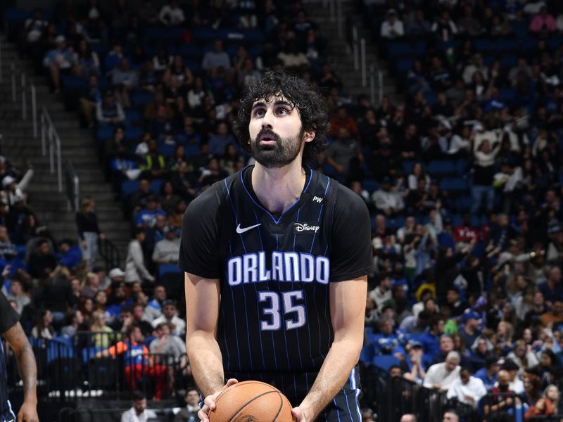 ORLANDO, FL - JANUARY 5 :  Goga Bitadze #35 of the Orlando Magic shoots a free throw during the game against the Utah Jazz on January 5, 2025 at Kia Center in Orlando, Florida. NOTE TO USER: User expressly acknowledges and agrees that, by downloading and or using this photograph, User is consenting to the terms and conditions of the Getty Images License Agreement. Mandatory Copyright Notice: Copyright 2025 NBAE (Photo by Fernando Medina/NBAE via Getty Images)