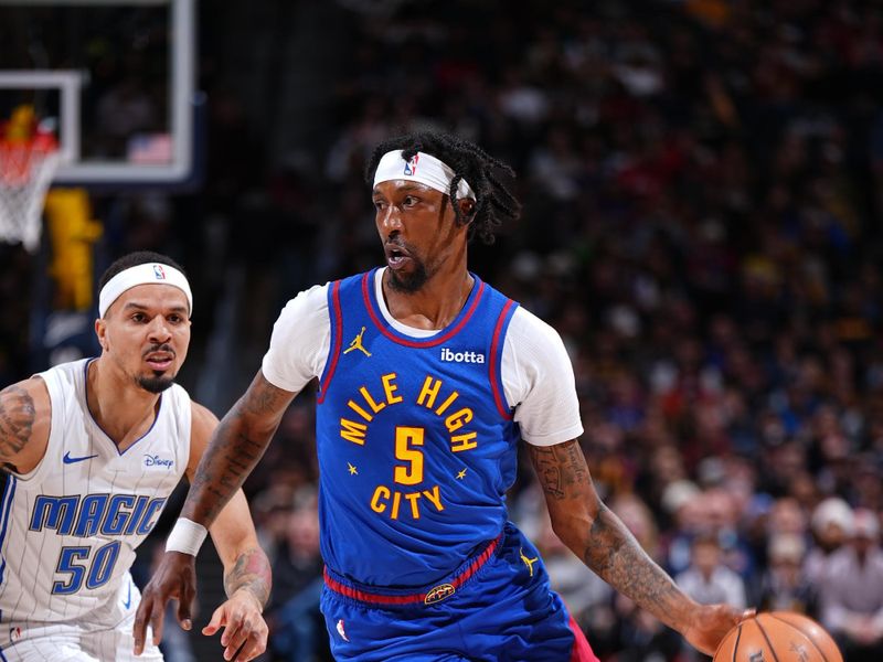 DENVER, CO - JANUARY 5: Kentavious Caldwell-Pope #5 of the Denver Nuggets drives to the basket during the game against the Orlando Magic on January 5, 2024 at the Ball Arena in Denver, Colorado. NOTE TO USER: User expressly acknowledges and agrees that, by downloading and/or using this Photograph, user is consenting to the terms and conditions of the Getty Images License Agreement. Mandatory Copyright Notice: Copyright 2024 NBAE (Photo by Garrett Ellwood/NBAE via Getty Images)