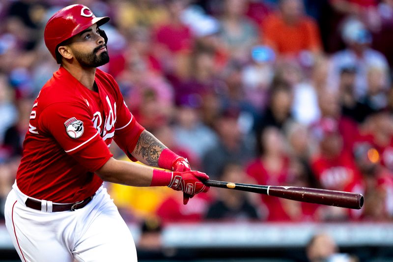 Sep 23, 2023; Cincinnati, Ohio, USA; Cincinnati Reds designated hitter Christian Encarnacion-Strand (33) watches his ball leave the park for a 2-run home run in the first inning against the Pittsburgh Pirates at Great American Ball Park. Mandatory Credit: The Cincinnati Enquirer-USA TODAY Sports