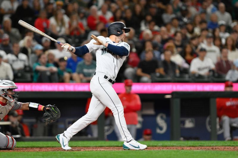 Sep 11, 2023; Seattle, Washington, USA; Seattle Mariners right fielder Jarred Kelenic (10) hits a single against the Los Angeles Angels during the fifth inning at T-Mobile Park. Mandatory Credit: Steven Bisig-USA TODAY Sports