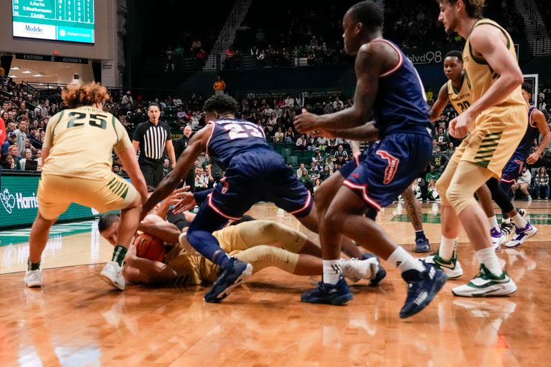 Jan 6, 2024; Charlotte, North Carolina, USA; Players from Florida Atlantic Owls and Charlotte 49ers scrum for the loose ball late during the second half at Dale F. Halton Arena. Mandatory Credit: Jim Dedmon-USA TODAY Sports