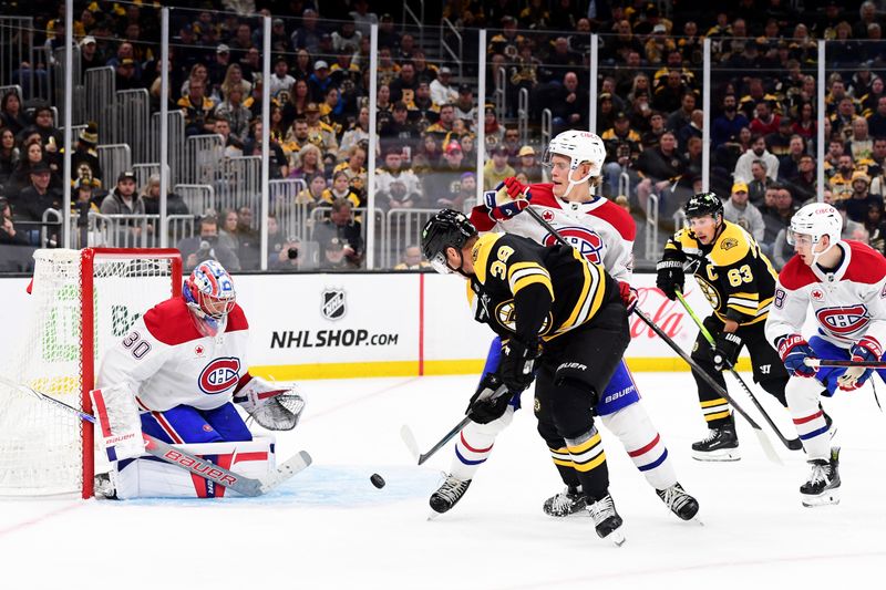 Oct 10, 2024; Boston, Massachusetts, USA; Boston Bruins center Morgan Geekie (39) battles with Montreal Canadiens defenseman Kaiden Guhle (21) in front of goaltender Cayden Primeau (30) during the third period at TD Garden. Mandatory Credit: Bob DeChiara-Imagn Images