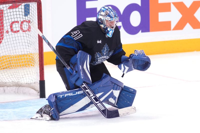 Dec 2, 2024; Toronto, Ontario, CAN; Toronto Maple Leafs goaltender Anthony Stolarz (41) goes to make a save during warm up before a game against the Chicago Blackhawks at Scotiabank Arena. Mandatory Credit: John E. Sokolowski-Imagn Images