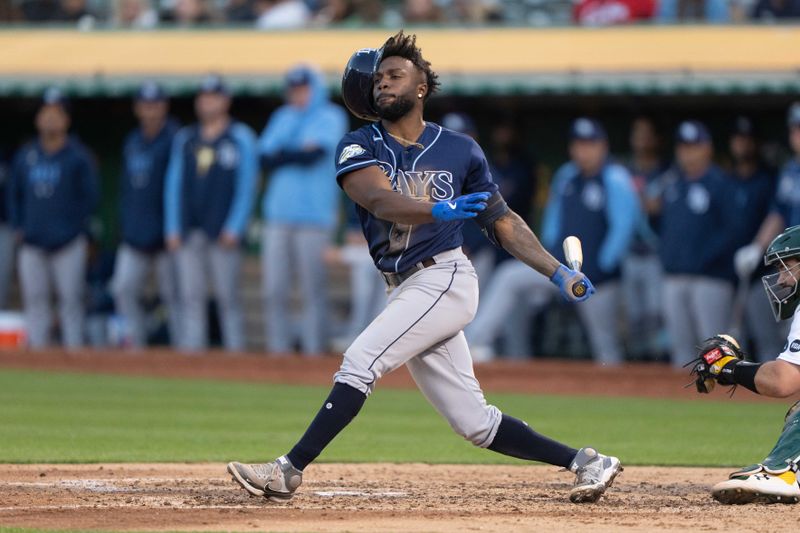 Jun 14, 2023; Oakland, California, USA;  Tampa Bay Rays left fielder Randy Arozarena (56) loses his helmet during the fifth inning against the Oakland Athletics at Oakland-Alameda County Coliseum. Mandatory Credit: Stan Szeto-USA TODAY Sports