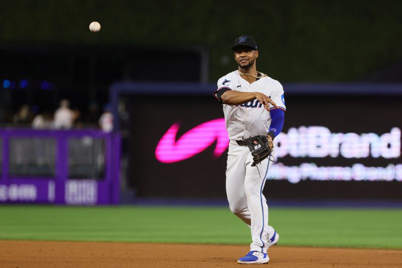 Sep 4, 2024; Miami, Florida, USA; Miami Marlins second baseman Otto Lopez (61) throws to first base to retire Washington Nationals second baseman Luis Garcia Jr. (not pictured) during the seventh inning at loanDepot Park. Mandatory Credit: Sam Navarro-Imagn Images