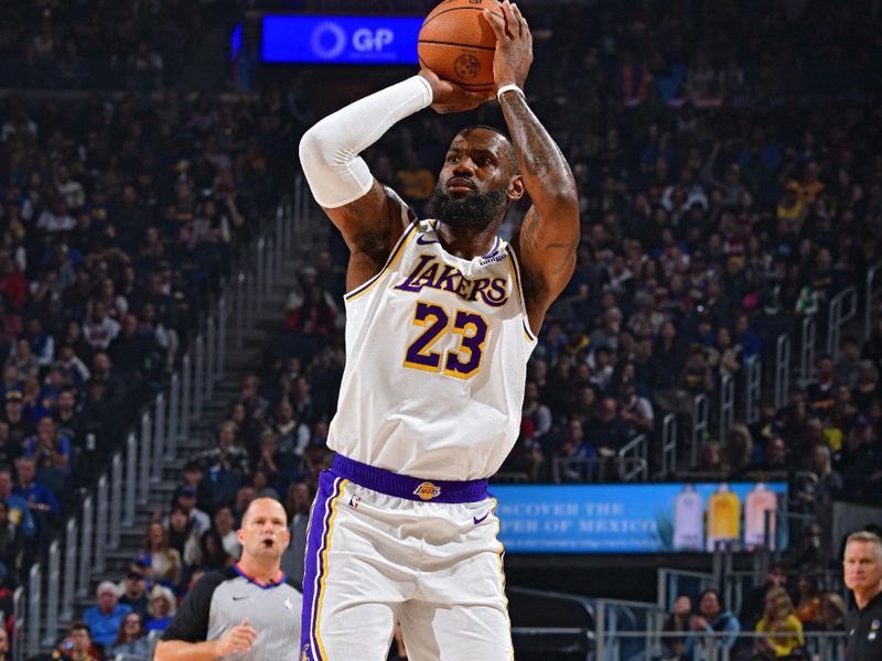 SAN FRANCISCO, CA - JANUARY 27:  LeBron James #23 of the Los Angeles Lakers shoots a three point basket against the Golden State Warriors on January 27, 2024 at Chase Center in San Francisco, California. NOTE TO USER: User expressly acknowledges and agrees that, by downloading and or using this photograph, user is consenting to the terms and conditions of Getty Images License Agreement. Mandatory Copyright Notice: Copyright 2024 NBAE (Photo by Barry Gossage/NBAE via Getty Images)