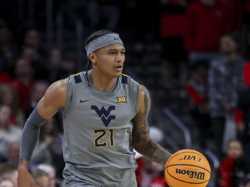 Mar 9, 2024; Cincinnati, Ohio, USA; West Virginia Mountaineers guard RaeQuan Battle (21) dribbles against the Cincinnati Bearcats in the second half at Fifth Third Arena. Mandatory Credit: Katie Stratman-USA TODAY Sports