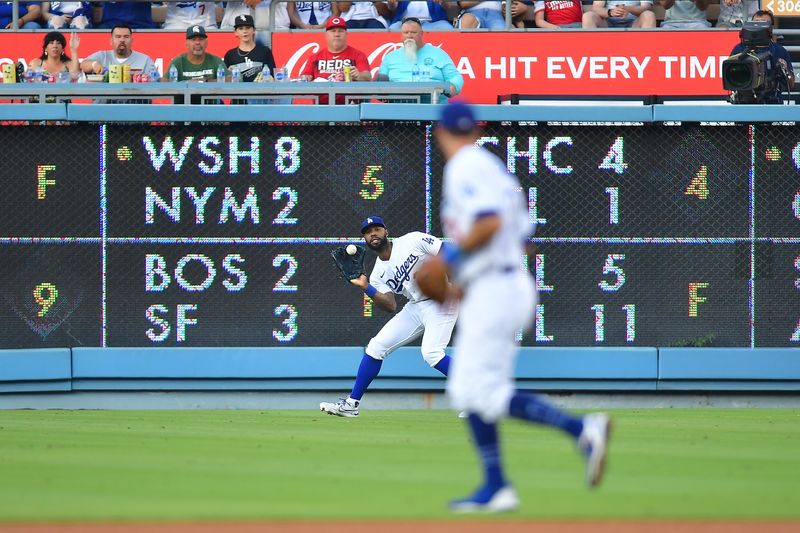 Jul 29, 2023; Los Angeles, California, USA; Los Angeles Dodgers right fielder Jason Heyward (23) catches the fly ball of Cincinnati Reds first baseman Joey Votto (19) during the fourth inning at Dodger Stadium. Mandatory Credit: Gary A. Vasquez-USA TODAY 