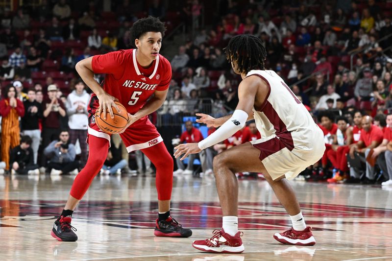 Feb 11, 2023; Chestnut Hill, Massachusetts, USA; North Carolina State Wolfpack guard Jack Clark (5) dribbles the ball in front of North Carolina State Wolfpack guard Jarkel Joiner (1) during the first half at the Conte Forum. Mandatory Credit: Brian Fluharty-USA TODAY Sports