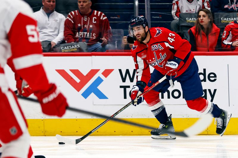 Mar 18, 2025; Washington, District of Columbia, USA; Washington Capitals right wing Tom Wilson (43) moves the puck during the first period against the Detroit Red Wings at Capital One Arena. Mandatory Credit: Peter Casey-Imagn Images