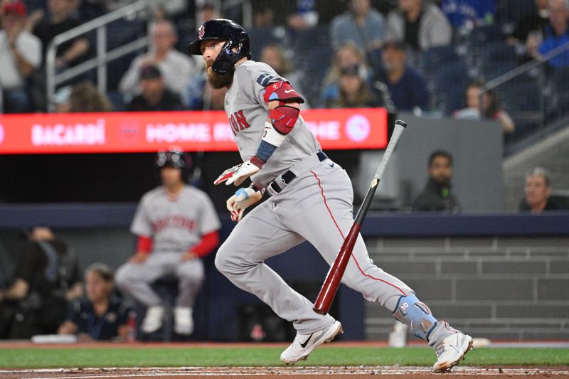 Sep 24, 2024; Toronto, Ontario, CAN; Boston Red Sox shortstop Trevor Story (10) hits a double against the Toronto Blue Jays in the second inning at Rogers Centre. Mandatory Credit: Dan Hamilton-Imagn Images