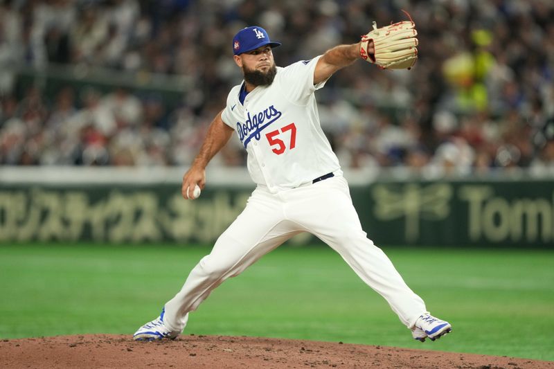 Mar 19, 2025; Bunkyo, Tokyo, JPN; Los Angeles Dodgers relief pitcher Luis García (57) delivers a pitch during the fourth inning against the Chicago Cubs during the Tokyo Series at Tokyo Dome. Mandatory Credit: Darren Yamashita-Imagn Images
