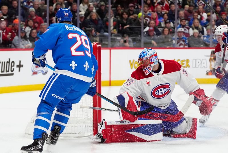 Nov 29, 2025; Denver, Colorado, USA; Montreal Canadiens goaltender Jakub Dobes (75) defends on Colorado Avalanche center Nathan MacKinnon (29) in the second period at Ball Arena. Mandatory Credit: Ron Chenoy-Imagn Images